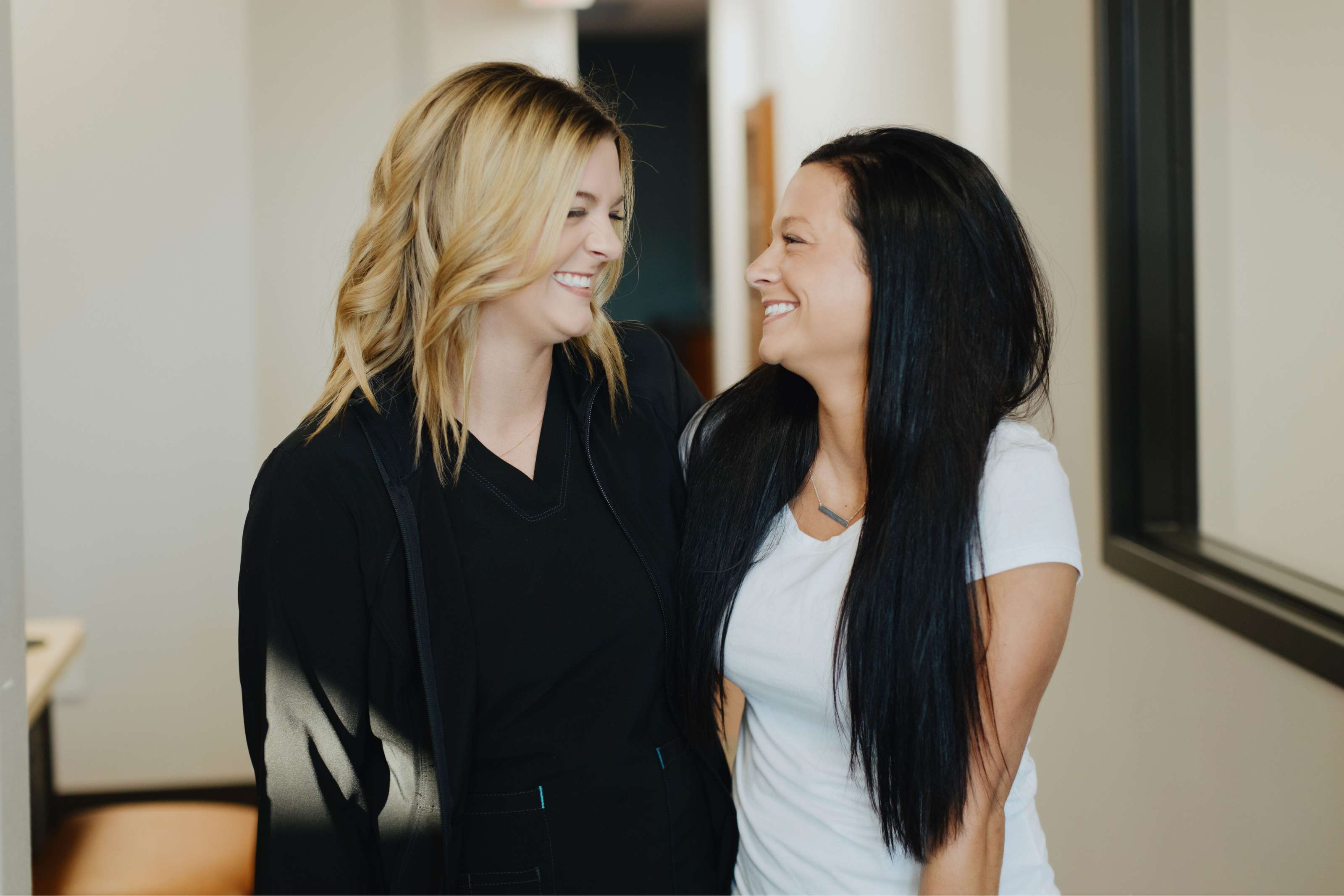 a couple of women smiling