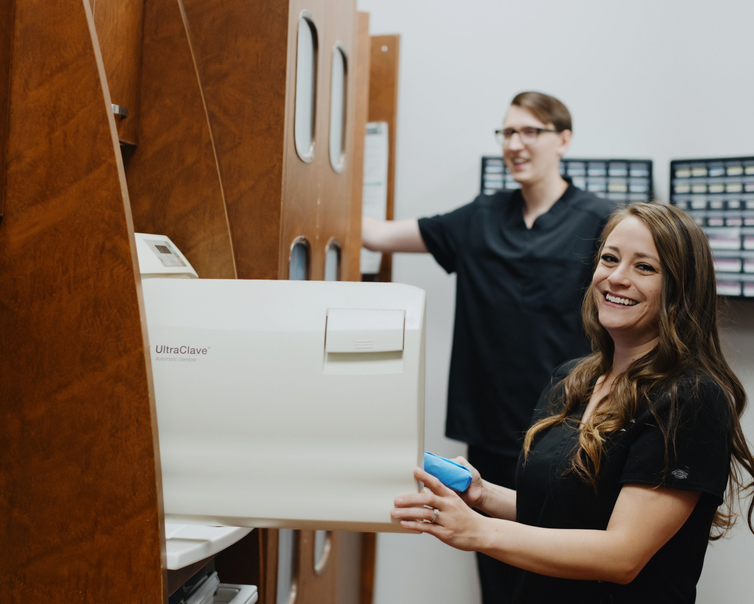 Staff with sanitizing machine
