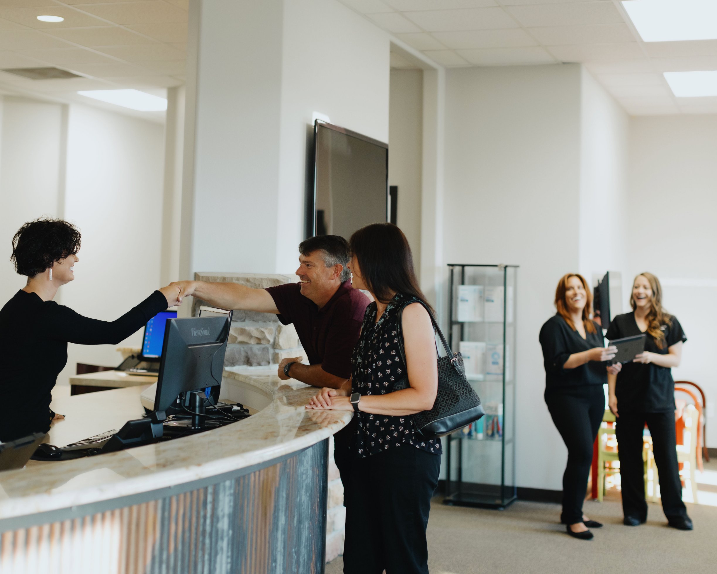 Patients greeted by receptionist