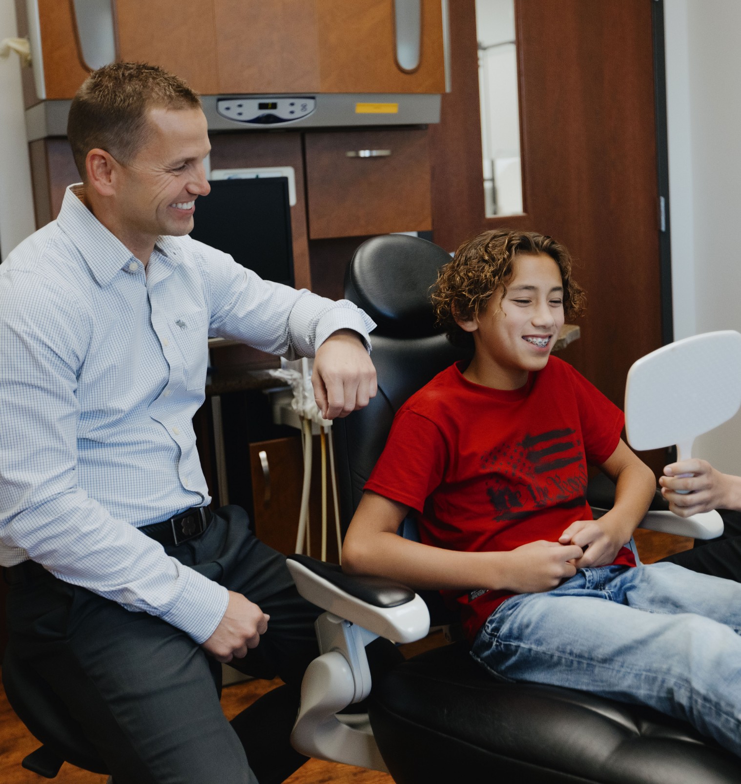 Dr. Gallup and male patient smiling